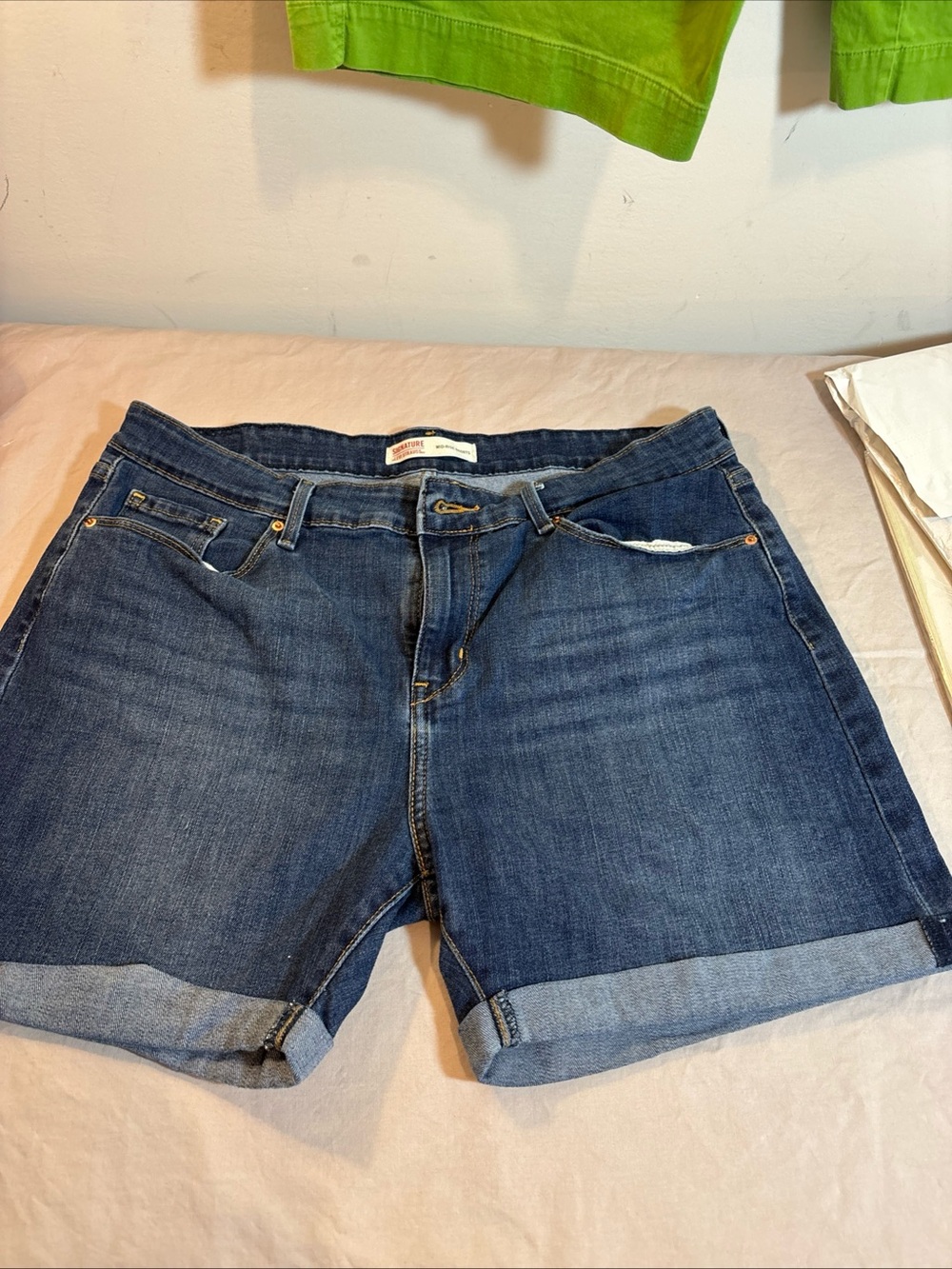 Levi’s Strauss Dark Wash Rolled Hem Denim Shorts.  657